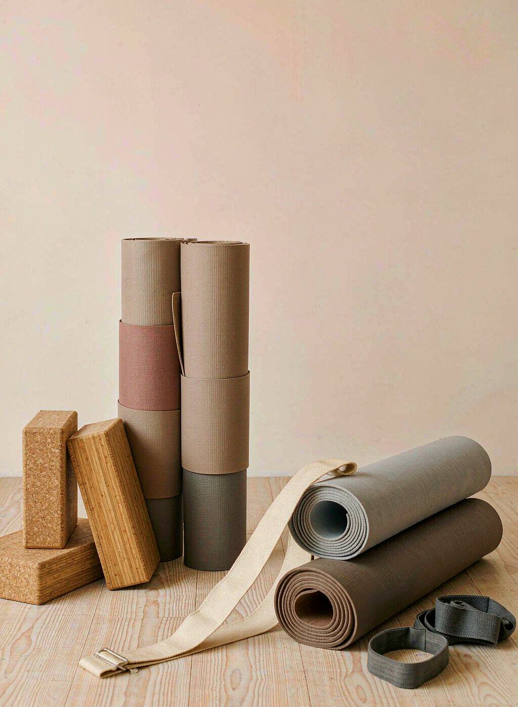 Rolled yoga mats, cork blocks and resistance bands