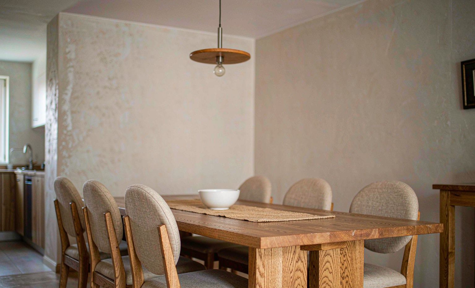 Solid oak dining table with six upholstered chairs