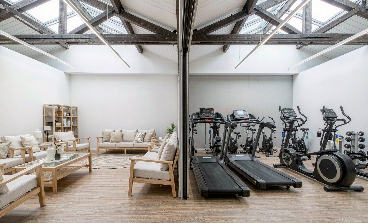 Showroom with a furniture display on one side and fitness equipment on the other